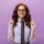 ginger-lady-in-eyeglasses-and-shirt-pointing-up-on-M4QZJLL